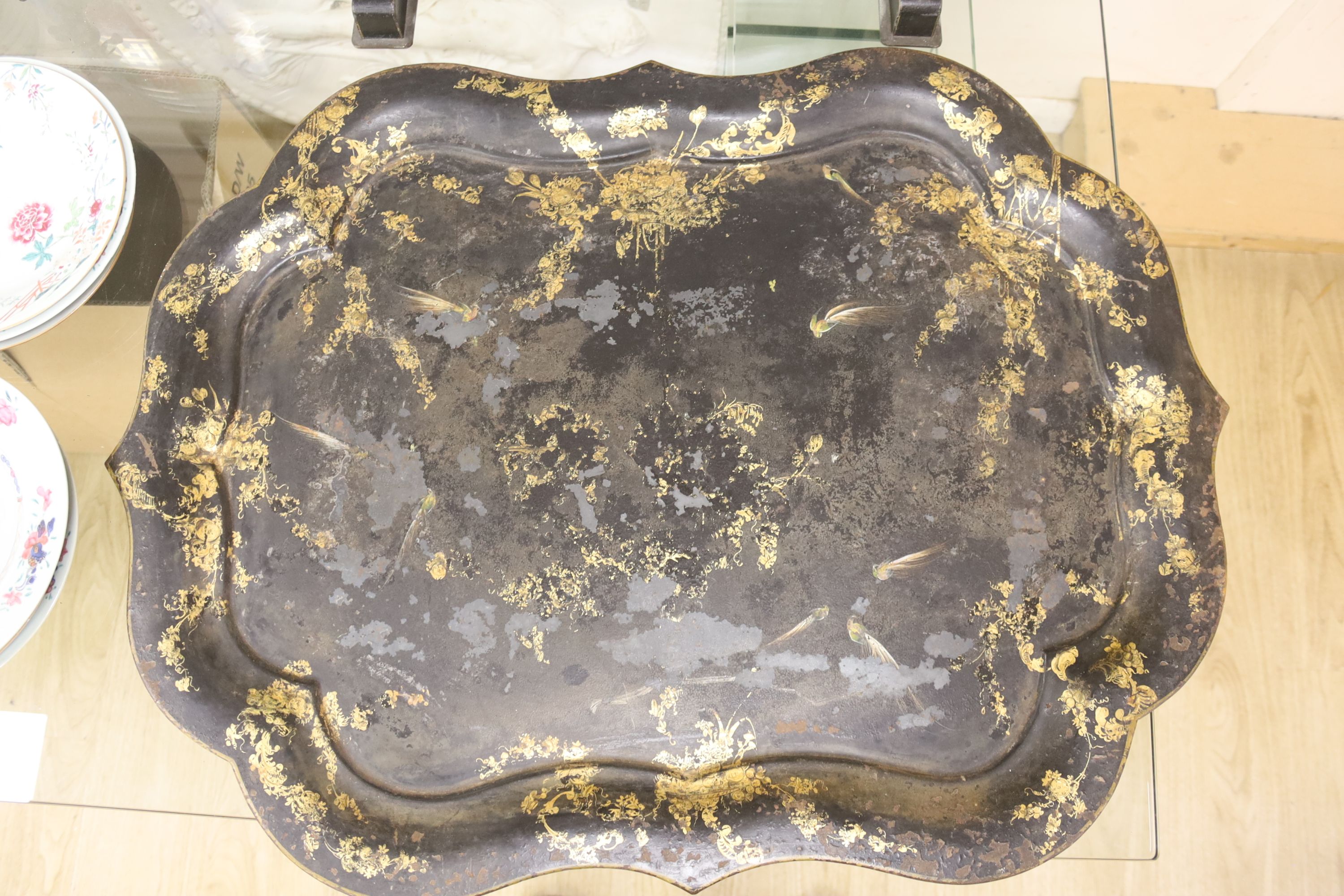 A large early Victorian papier mache tray on folding stand, 79 x 48cm, and a toleware tray